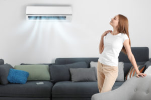 girl looking at air conditioner